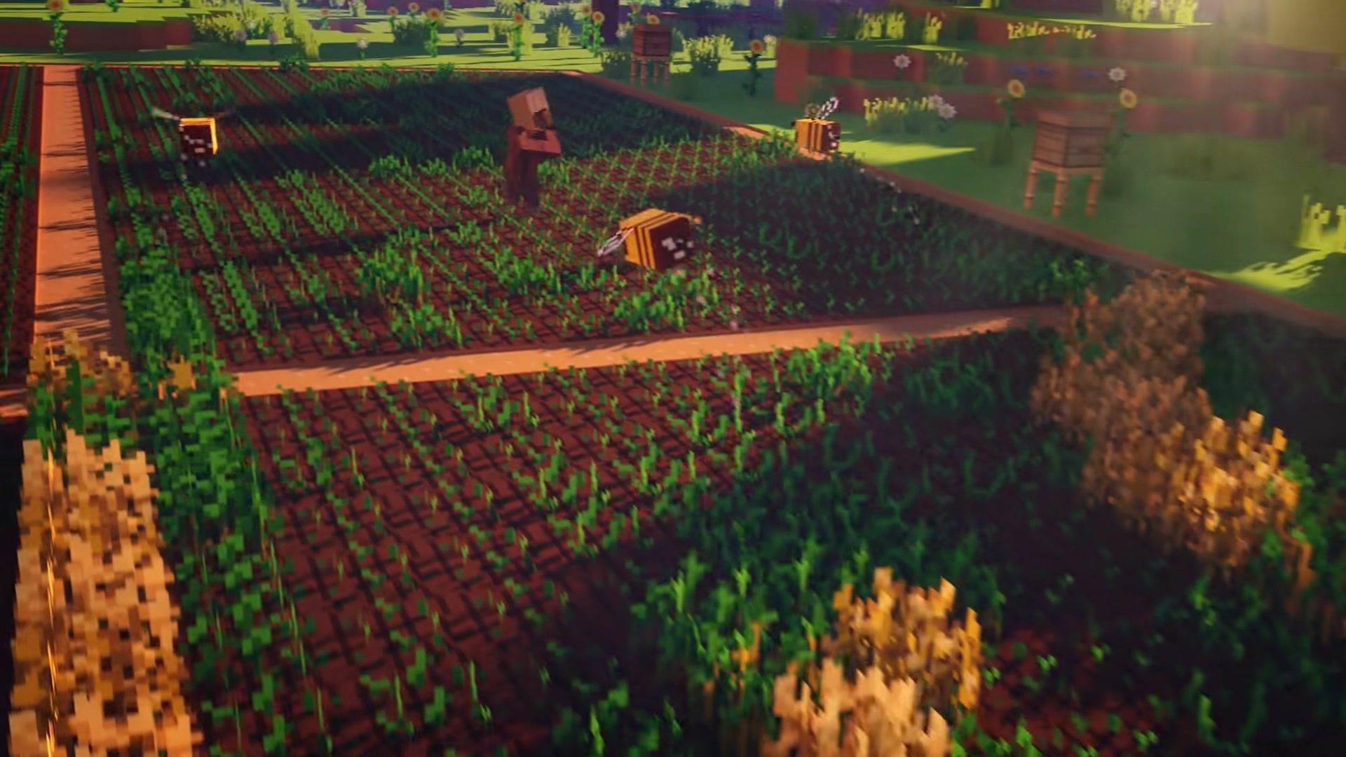 Melhores jogos de fazenda - Minecraft.  Uma captura de tela mostra um trecho de terras agrícolas com abelhas voando e aldeões em pé no meio dela.