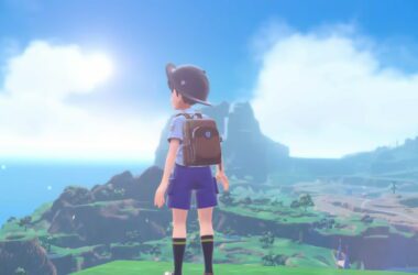 A young trainer standing in front of a landscape.