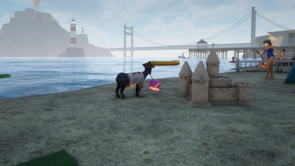 Cabra com um balde roxo na praia
